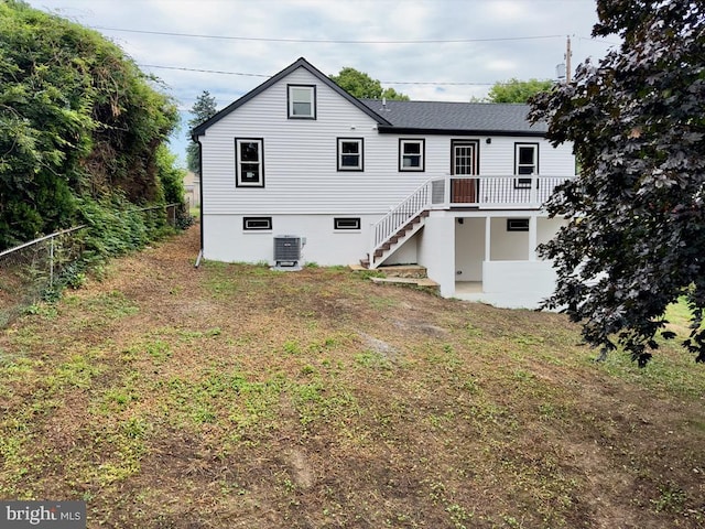 back of house featuring central air condition unit