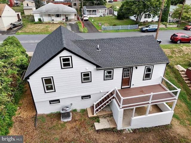 rear view of house with a wooden deck