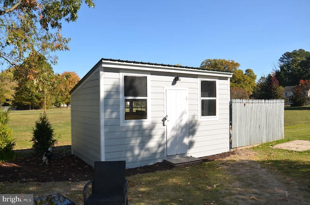 view of outdoor structure with a lawn