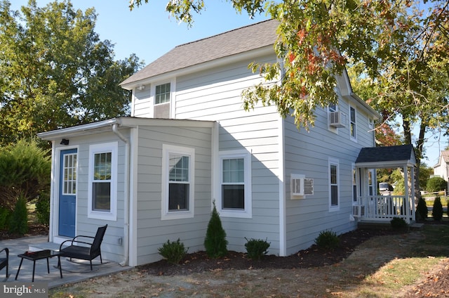 view of side of property featuring a patio