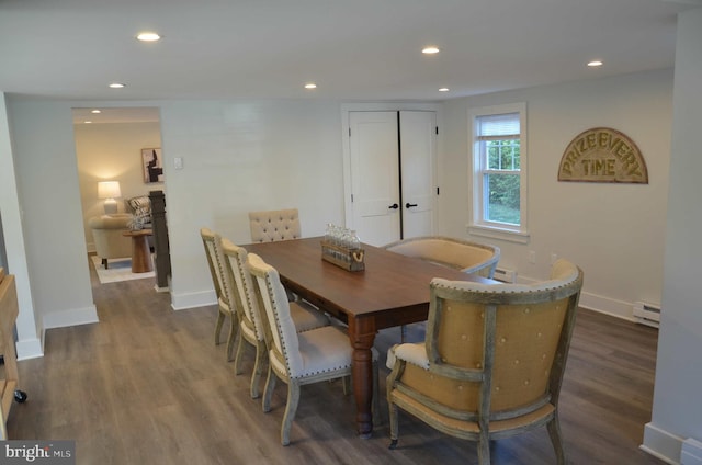 dining area featuring dark hardwood / wood-style flooring and baseboard heating