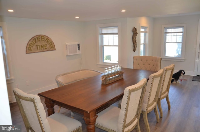 dining area with dark hardwood / wood-style flooring and plenty of natural light