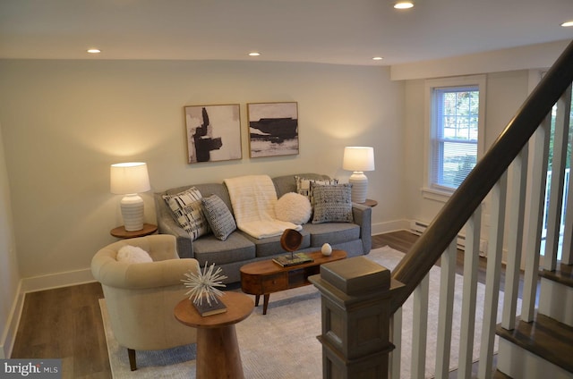 living room featuring dark hardwood / wood-style flooring and lofted ceiling