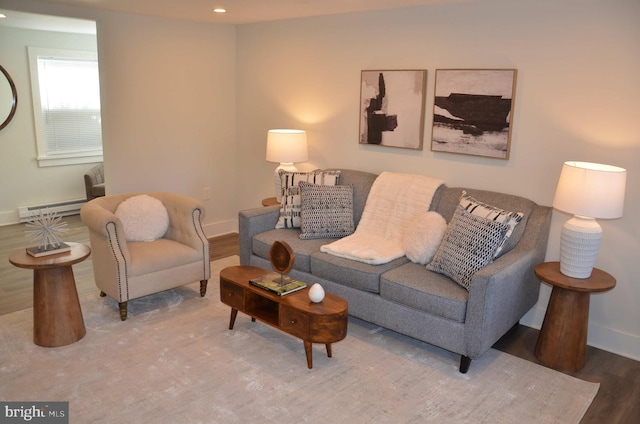 living room with hardwood / wood-style floors and a baseboard radiator