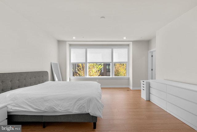 bedroom with light wood-type flooring