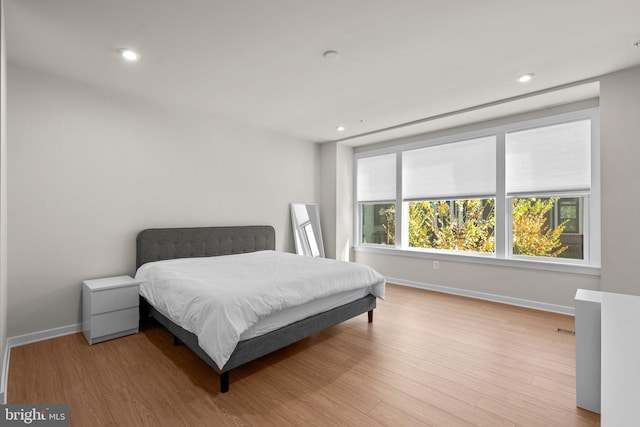 bedroom with light hardwood / wood-style floors