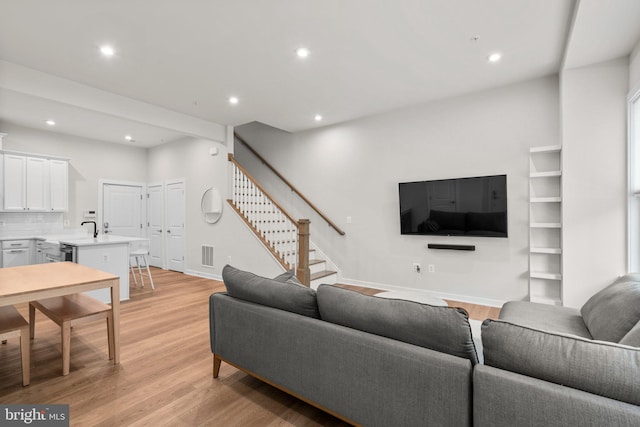 living room featuring light wood-type flooring