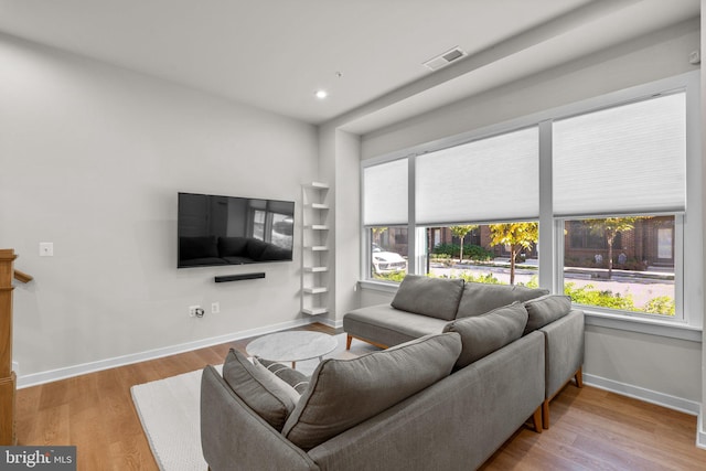 living room featuring light hardwood / wood-style flooring and plenty of natural light