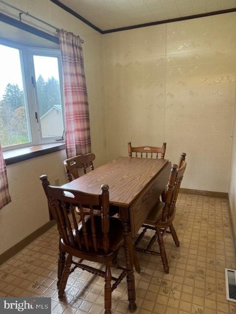 dining room with crown molding