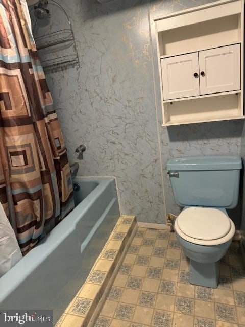 bathroom with toilet and shower / bath combination with curtain