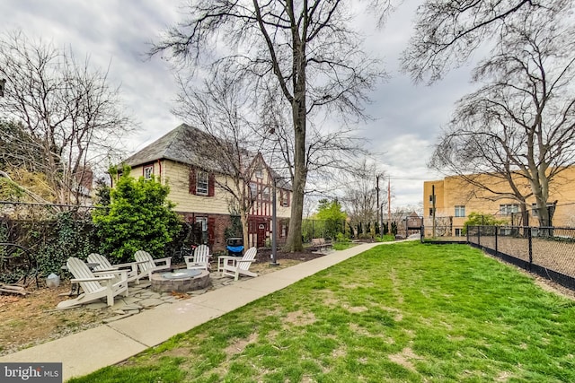 view of yard with an outdoor fire pit