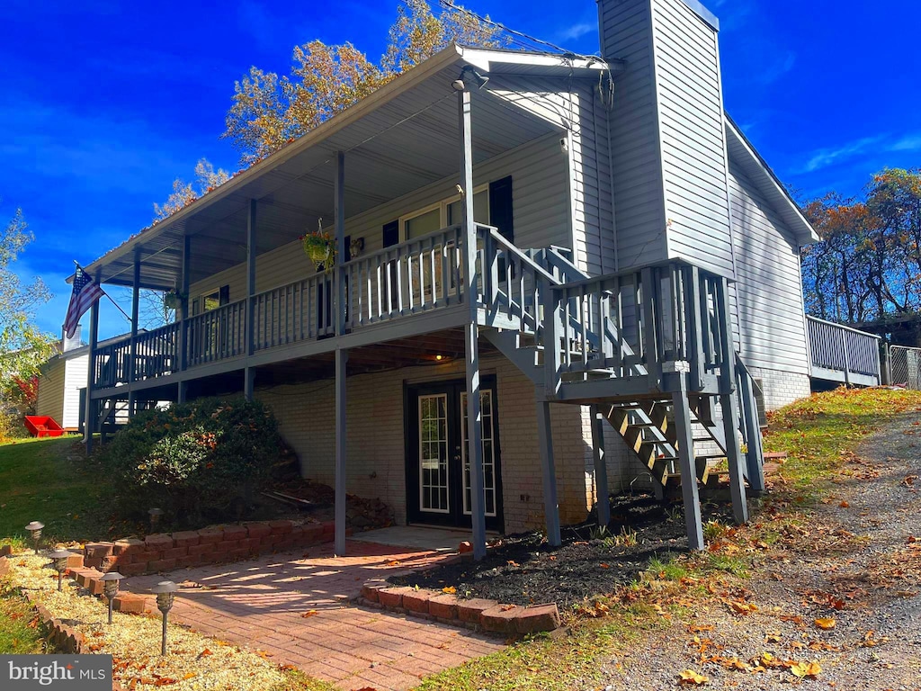 back of property with a patio area