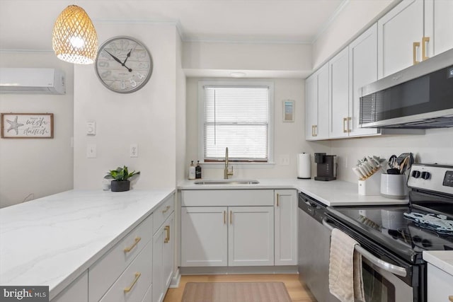 2803 Gull Way Unit B01, Ocean City, MD 21842 - kitchen with light stone countertops, a sink, a wall mounted AC, stainless steel appliances, and ornamental molding
