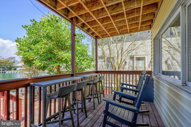 deck featuring a water view