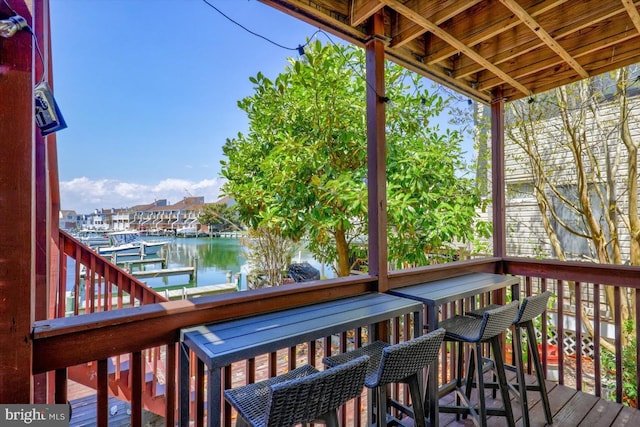 wooden deck with a water view