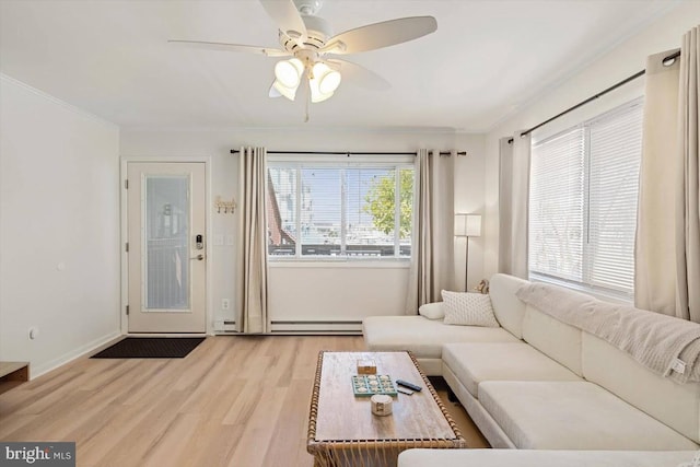 living room with light hardwood / wood-style flooring, ornamental molding, a baseboard radiator, and ceiling fan