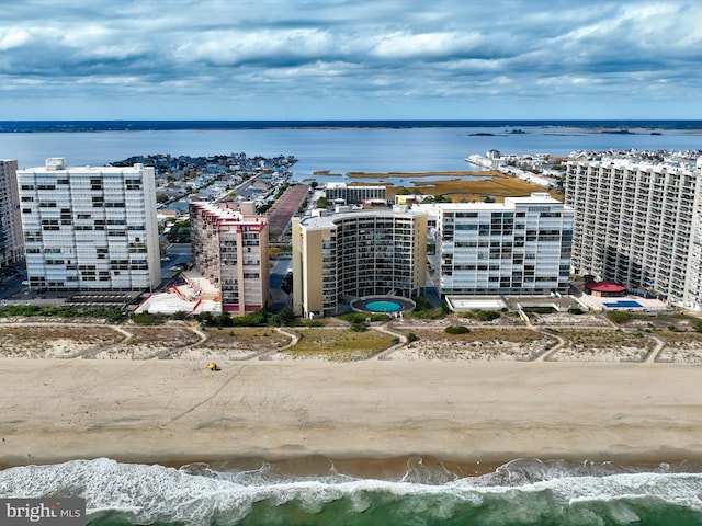 drone / aerial view with a view of the beach and a water view