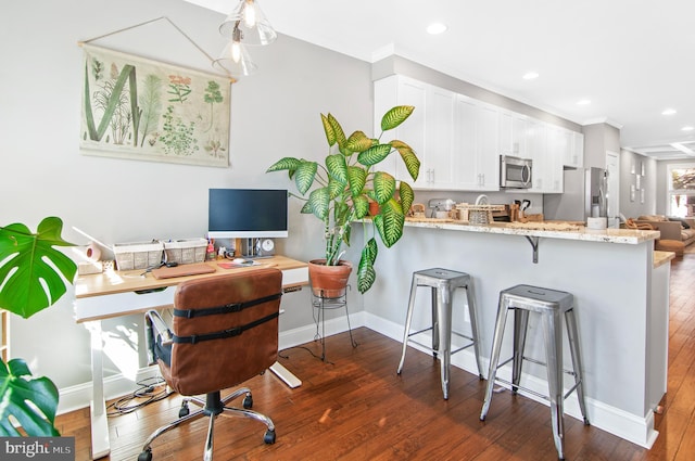 office with crown molding and dark hardwood / wood-style floors