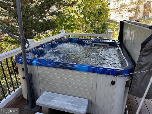 deck featuring a hot tub