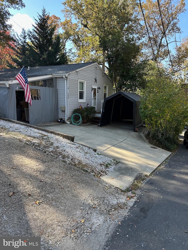 view of front of home with a carport