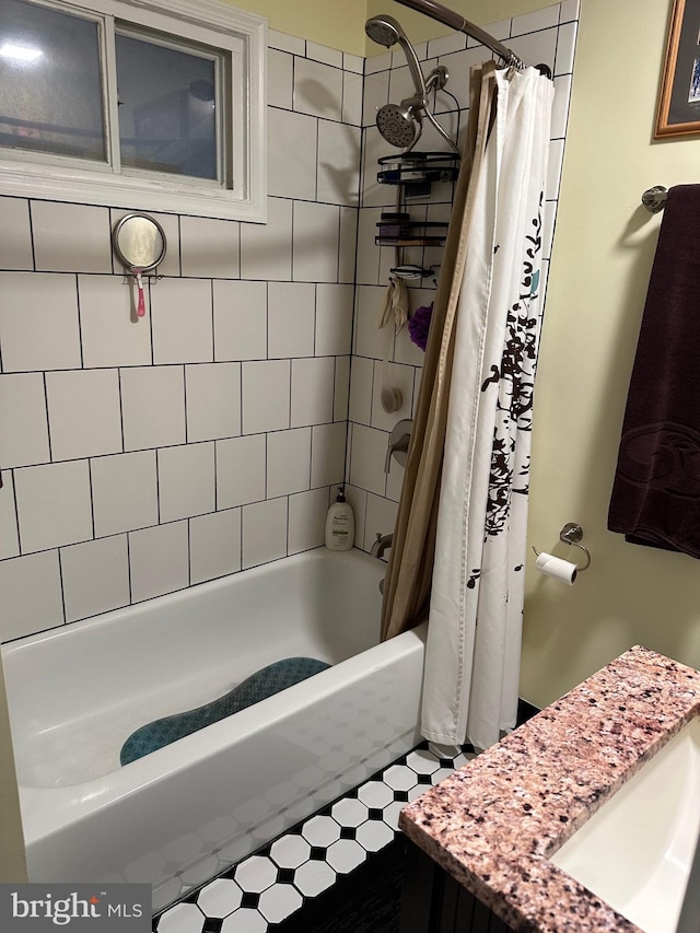 bathroom with vanity and shower / bathtub combination with curtain