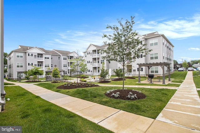 view of property's community with a yard