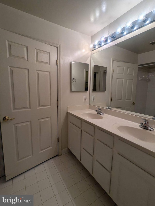 bathroom featuring vanity and tile patterned flooring