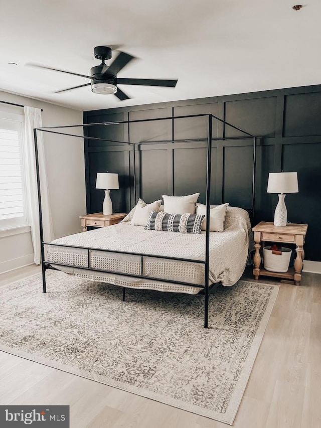 bedroom featuring light hardwood / wood-style flooring and ceiling fan