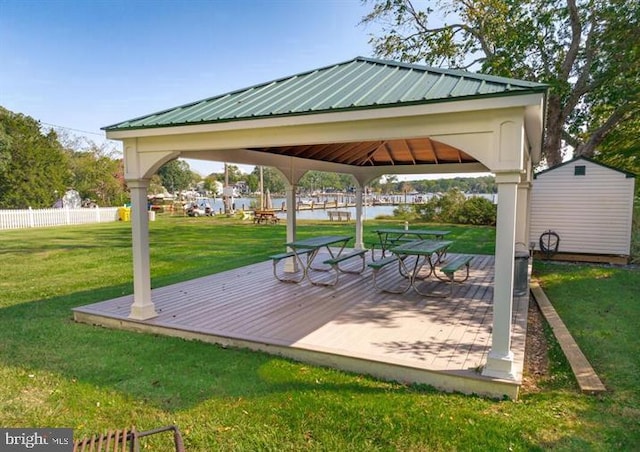 surrounding community featuring a yard, a gazebo, and a wooden deck