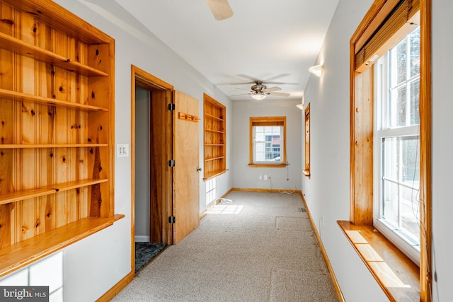 corridor with light carpet