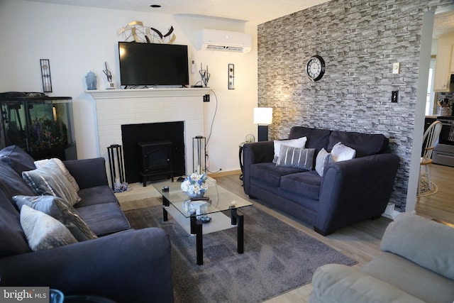 living room featuring a wall mounted air conditioner and hardwood / wood-style floors