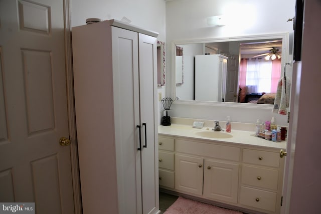 bathroom featuring vanity and ceiling fan