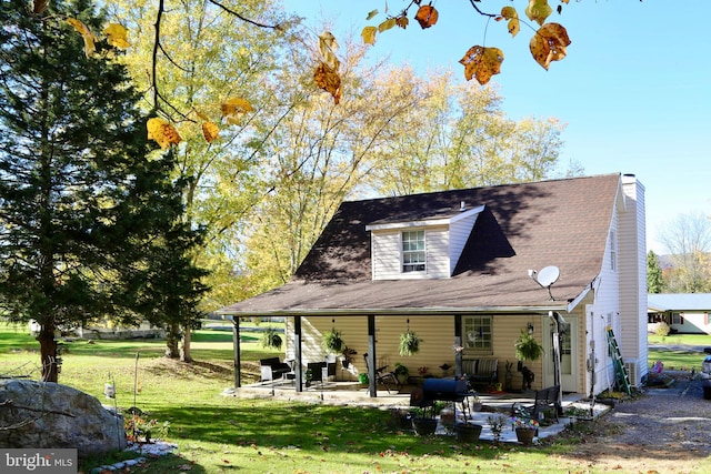 exterior space featuring a patio and a yard