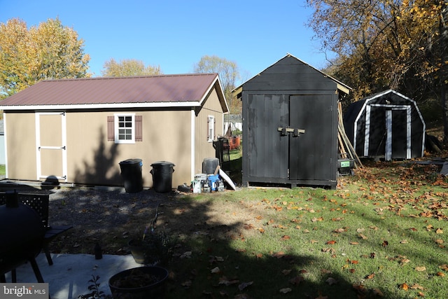 view of outdoor structure featuring a lawn