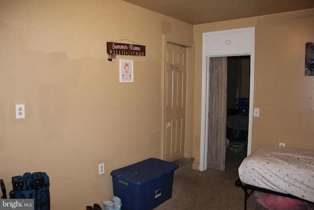 carpeted bedroom with a closet