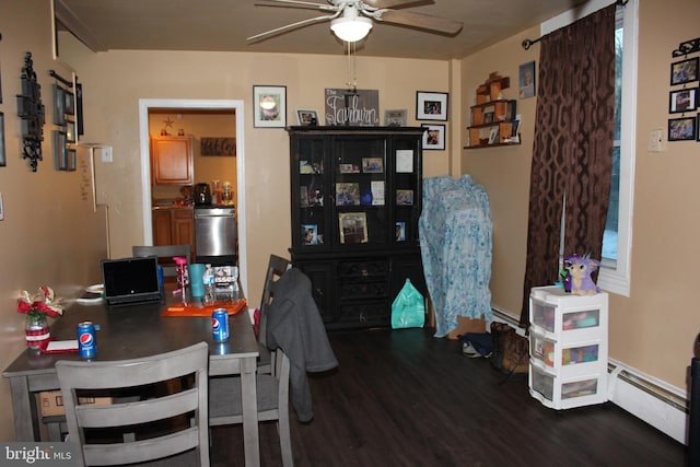 office space with ceiling fan, a baseboard radiator, and dark hardwood / wood-style flooring