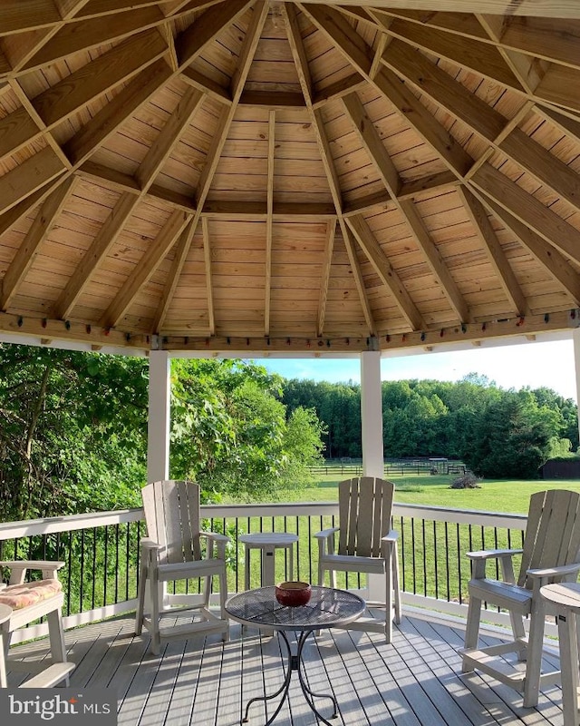 deck with a gazebo and a yard