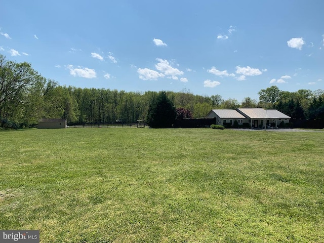 view of yard with a rural view