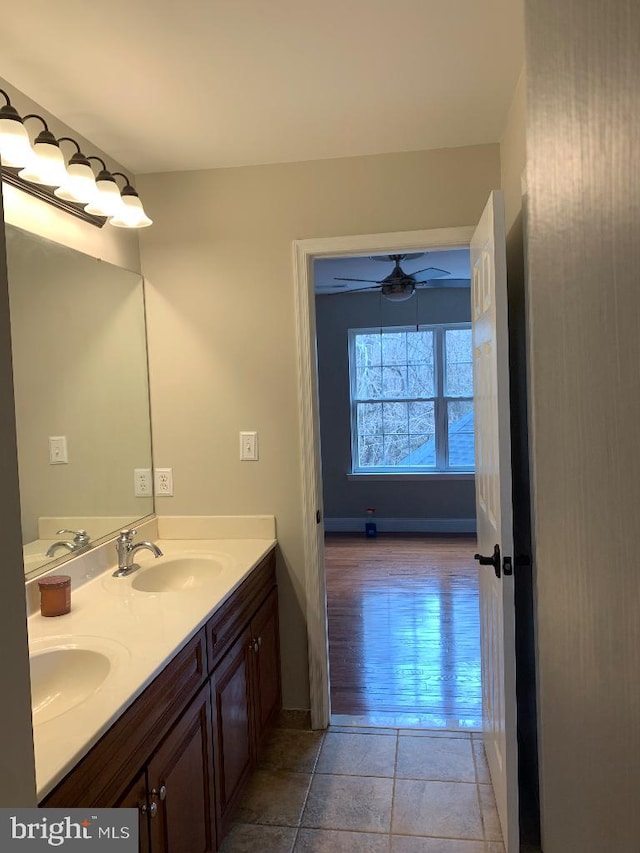 bathroom with vanity, hardwood / wood-style floors, and ceiling fan