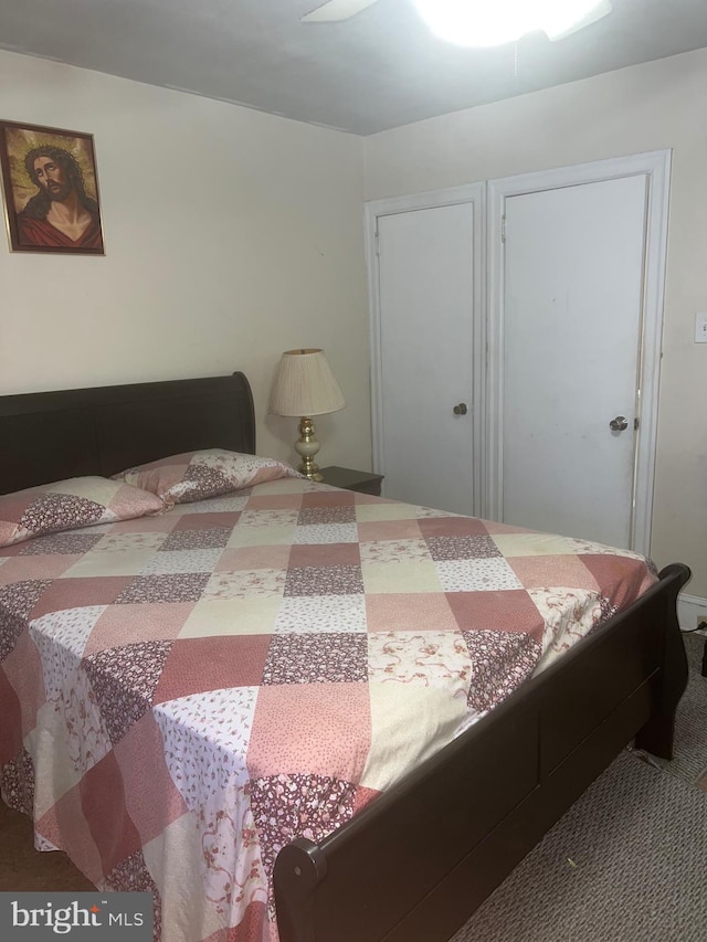 bedroom featuring ceiling fan and carpet flooring