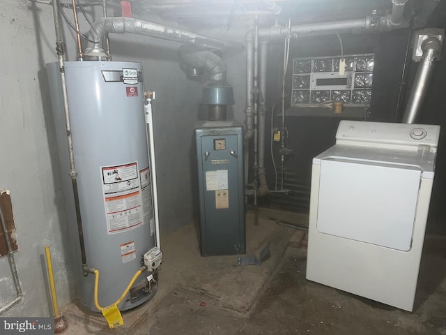 utilities featuring water heater and washer / clothes dryer