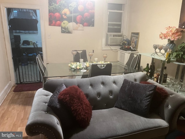 living room featuring hardwood / wood-style flooring and cooling unit