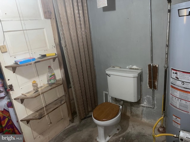 bathroom with water heater, concrete floors, and toilet