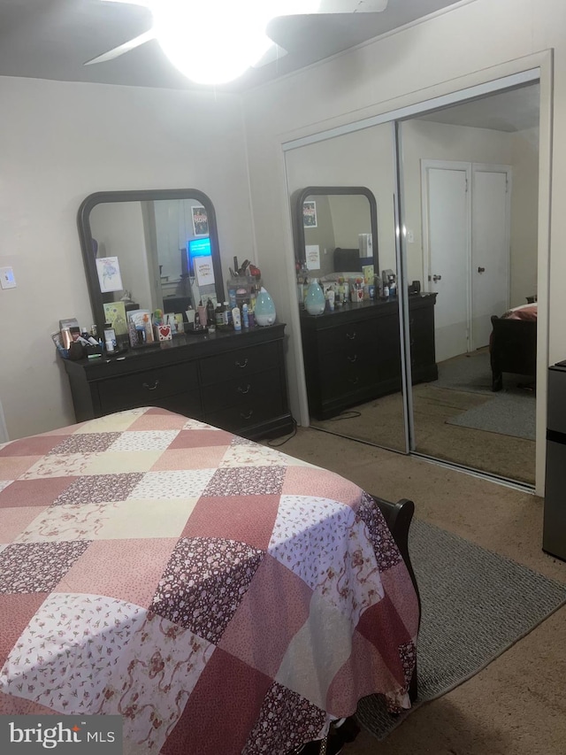 bedroom with carpet flooring, ceiling fan, and a closet