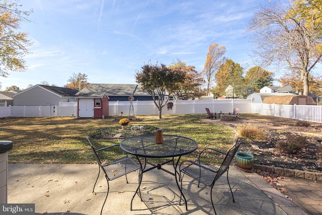 view of patio / terrace featuring a storage unit