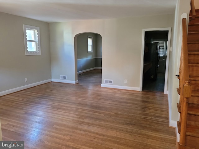 unfurnished room featuring hardwood / wood-style flooring