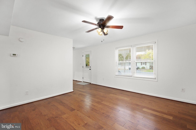 unfurnished room with ceiling fan and wood-type flooring