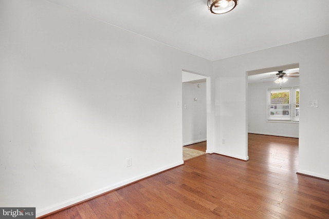 empty room featuring ceiling fan and wood-type flooring