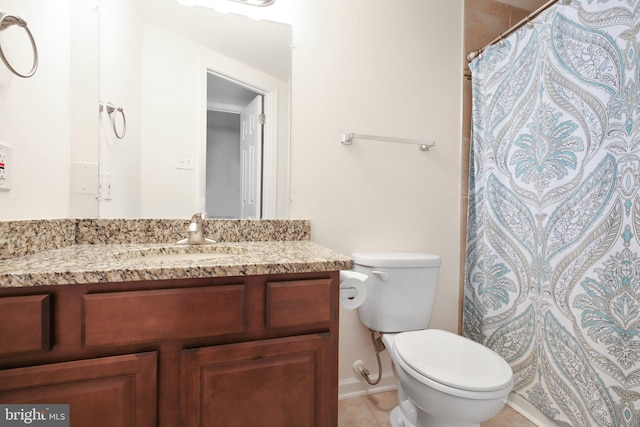 bathroom featuring tile patterned floors, vanity, toilet, and a shower with curtain