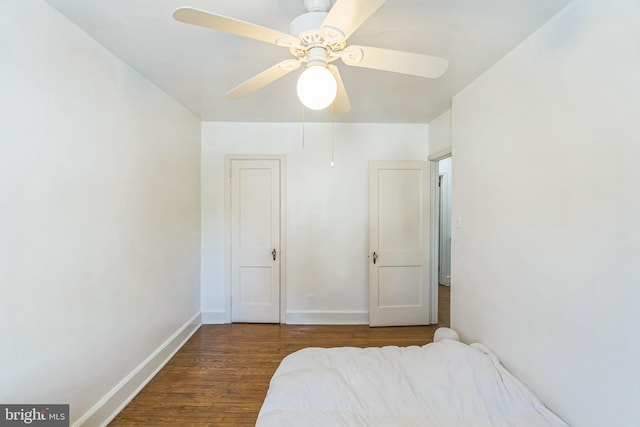 bedroom with hardwood / wood-style flooring and ceiling fan